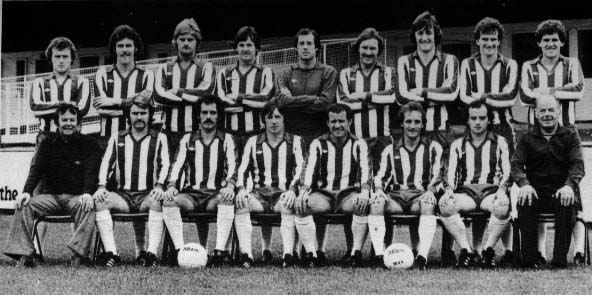 Wigan Athletic 1978/1979 Back Row: Kevin Smart, Peter Houghton, Neil Davids, Geoff Gay, John Brown, Frank Corrigan, Noel Ward, Joe Hinningan, Jeff Wright Front Row: Ian McNeill (Manager), Alan Crompton, Ian Seddon, Tommy Gore, Ian Gillibrand (captain), John Wilkie, Ian Purdie, Kenny Banks (Trainer)